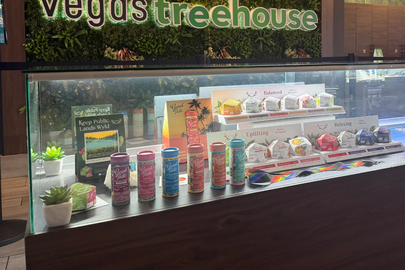 Packaged edibles arranged inside the lit front display case.
